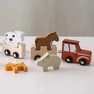 Wooden Montessori farmyard pull-along toy with animal figures and nesting shapes, designed for toddler learning and play.