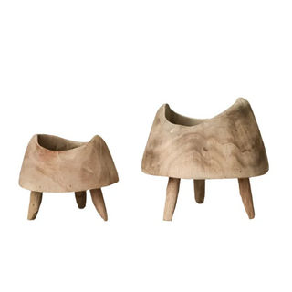 Handcrafted small high-foot display pieces made from Paulownia wood, showcasing a rustic design that highlights the natural beauty of wood and organic aesthetics. These decorative and practical accessories add texture and character to any setting, perfect for displaying fruit, plants, trinkets, potpourri, or holiday ornaments. Ideal for natural home décor.