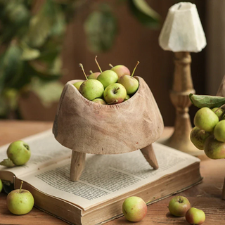 Handcrafted small high-foot display pieces made from Paulownia wood, showcasing a rustic design that highlights the natural beauty of wood and organic aesthetics. These decorative and practical accessories add texture and character to any setting, perfect for displaying fruit, plants, trinkets, potpourri, or holiday ornaments. Ideal for natural home décor.