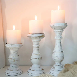 Rustic wooden candle holder crafted from solid mango wood with a distressed paint effect, perfect for adding natural charm to your home décor. Ideal for shelves, mantles, or coffee tables, this candle holder enhances the atmosphere of cosy evenings. Fitted with a metal candle plate, it can accommodate votive or pillar candles. Whether used alone or in a grouped centrepiece, this wooden candle holder creates a sophisticated, ambient glow with candlelight