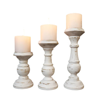 Rustic wooden candle holder crafted from solid mango wood with a distressed paint effect, perfect for adding natural charm to your home décor. Ideal for shelves, mantles, or coffee tables, this candle holder enhances the atmosphere of cosy evenings. Fitted with a metal candle plate, it can accommodate votive or pillar candles. Whether used alone or in a grouped centrepiece, this wooden candle holder creates a sophisticated, ambient glow with candlelight.