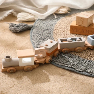 Montessori wooden train set with locomotive and carriages in neutral tones, ideal for toddler play and learning.