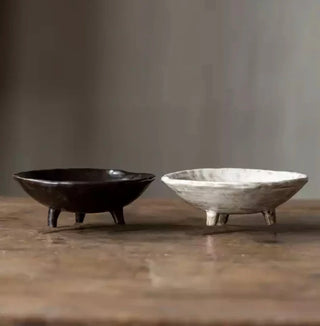 White and brown handmade ceramic raised serving dish with an uneven, textured surface and hand-rubbed glaze. This wabi-sabi inspired decorative fruit bowl adds a natural, organic touch to any home. Perfect as a unique display piece or functional home accessory. Shop artisanal pottery at our natural homeware store.
