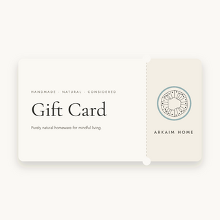Arkaim Home gift card with tear-off stub on an off-white background