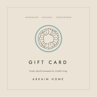 Arkaim Home gift card on stitched linen