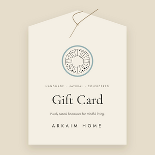 Arkaim Home gift card on a natural paper tag with twine