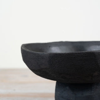 Decorative matte black bowl with organic curved silhouette.