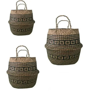 Four handwoven seagrass tribal baskets with black geometric patterns and handles