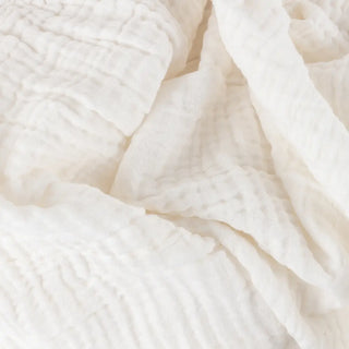 Close up of the crinkled muslin texture on the Nori white cotton throw